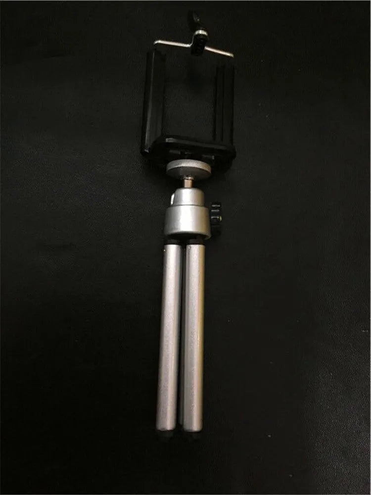 Black desktop mobile phone holder with adjustable two-section bracket for hands-free viewing.