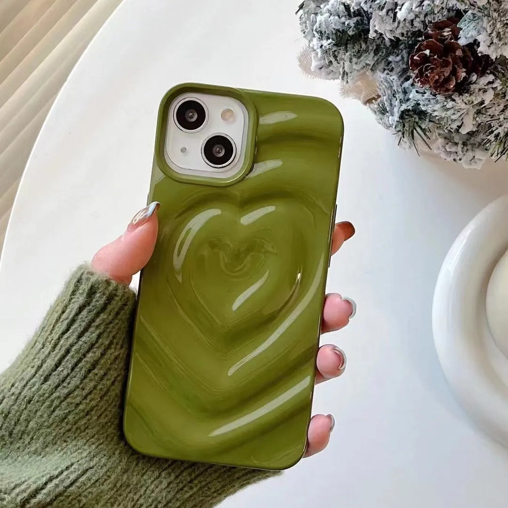 Solid colour iPhone case with a three-dimensional raised heart design on a glass back with TPU bumper.