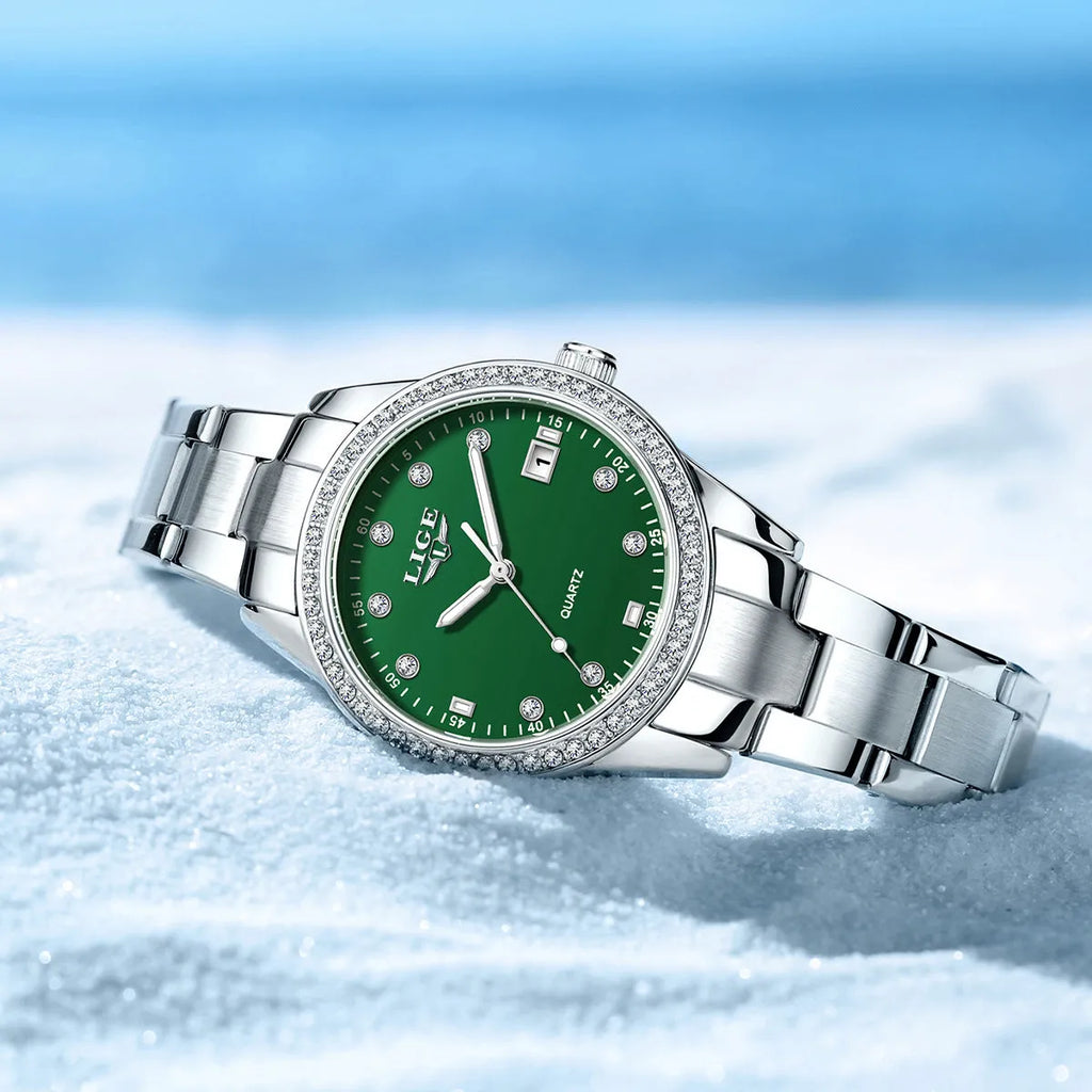 Silver fashion quartz watch with diamond dial accents and luminous hands on a 34mm stainless steel case.