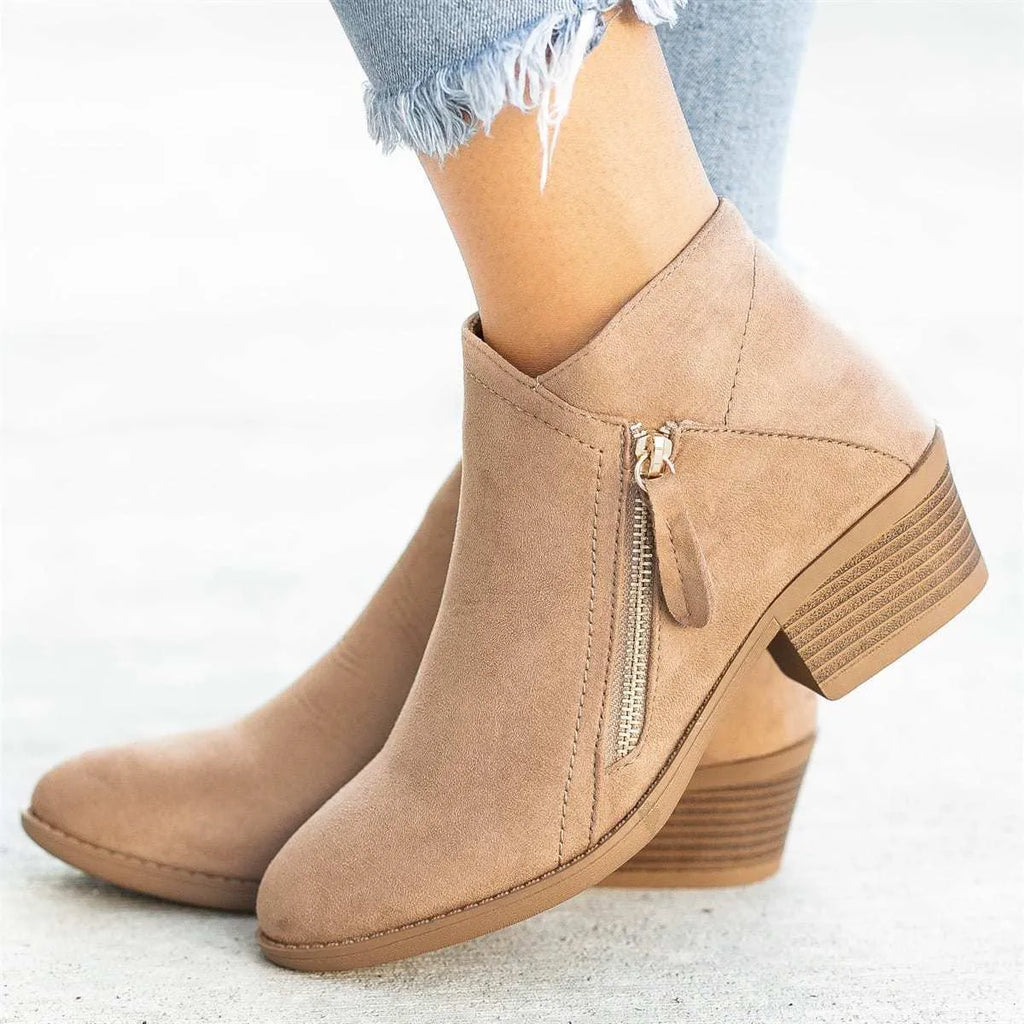 Women's suede ankle boot with side zipper and chunky heel in beige, black, blue, or orange.