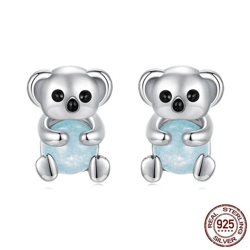 S925 sterling silver dangling koala bear earrings with dripping oil finish on a white background