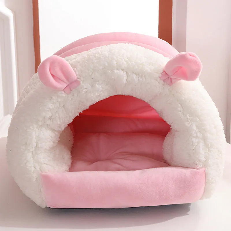 Closed cat nest bed in blue, shown with soft internal pad, illustrating its enclosed design for cats.