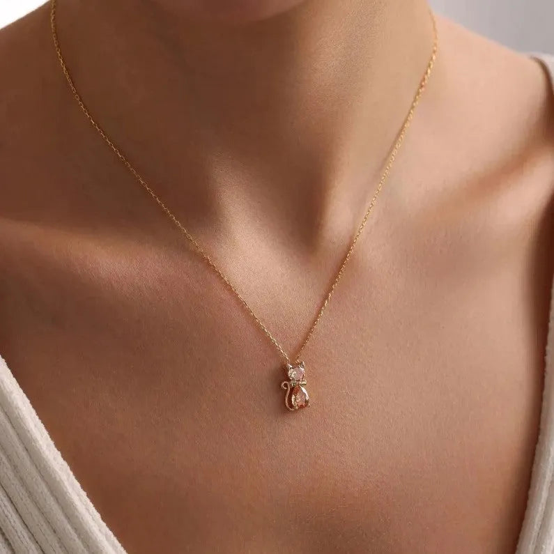 Sweet fashion necklace with titanium steel kitty pendant and coloured zircon stones on copper water wave chain.