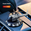 Silver metal solar-powered helicopter car air freshener spinning on a car dashboard
