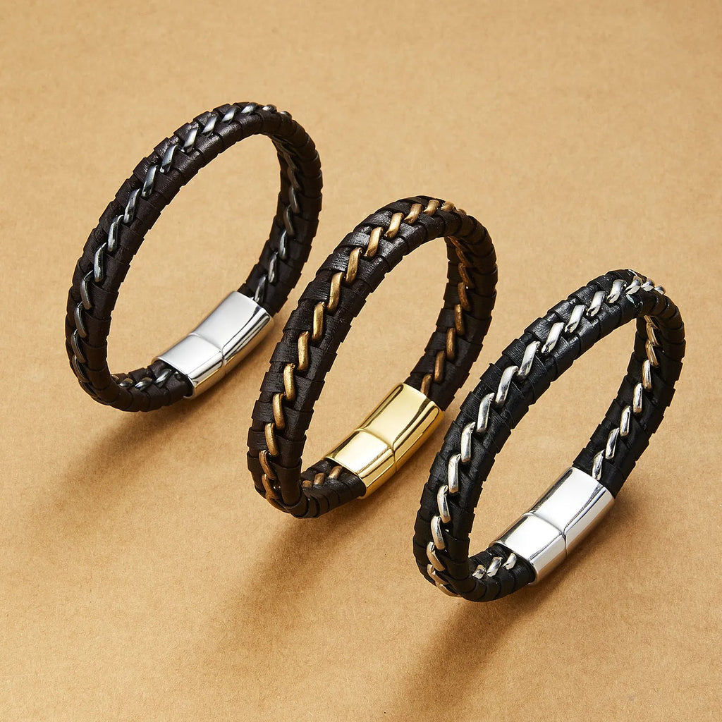 Woven leather bracelet for men with silver alloy cuff on a neutral background