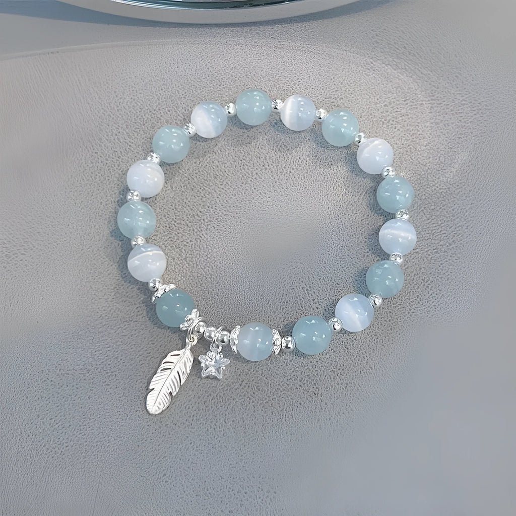 Small white crystal bracelet with blue moonlight colour and star design, Korean-style glass jewellery.