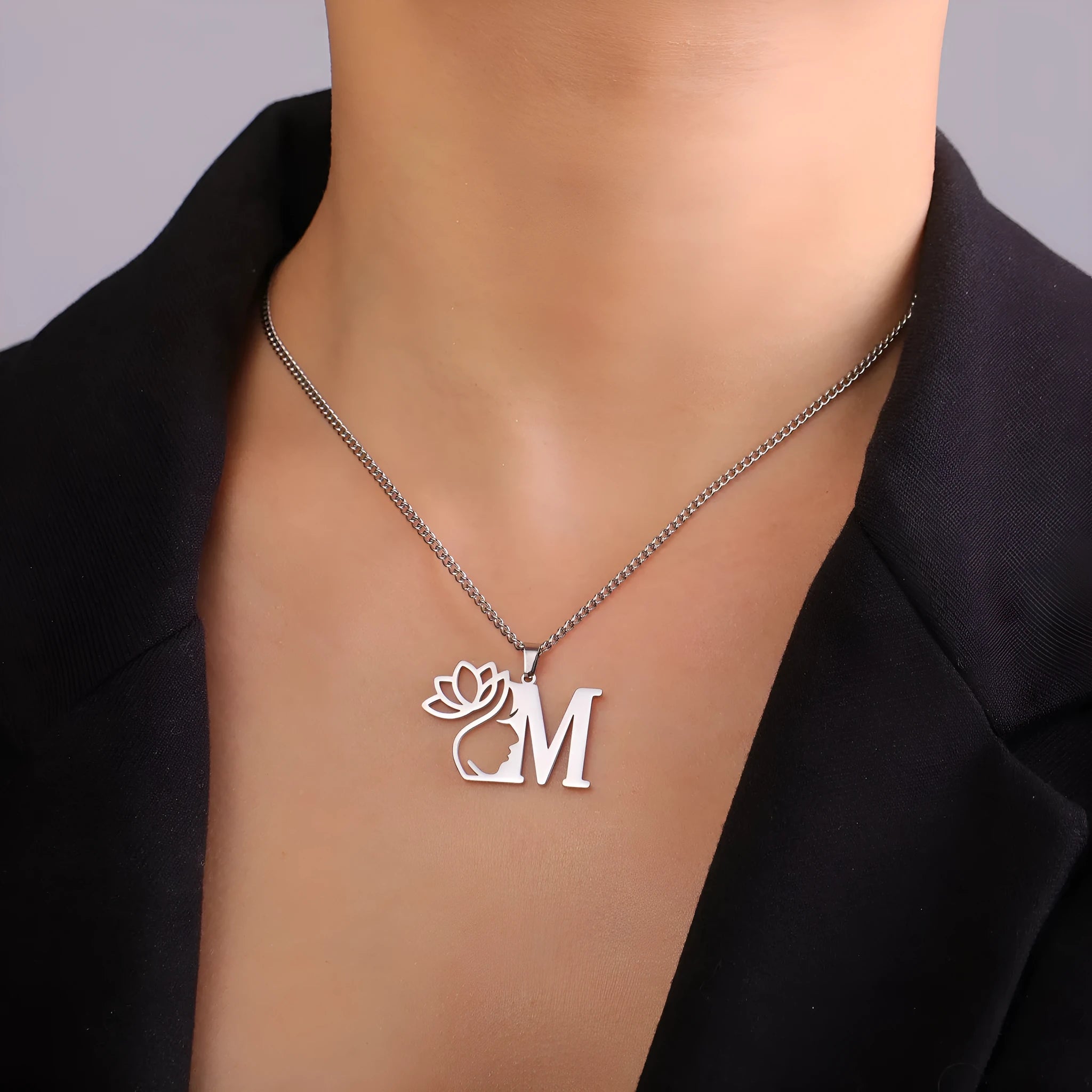 Stainless steel cross chain necklace with a pendant in gold or silver electroplated finish.