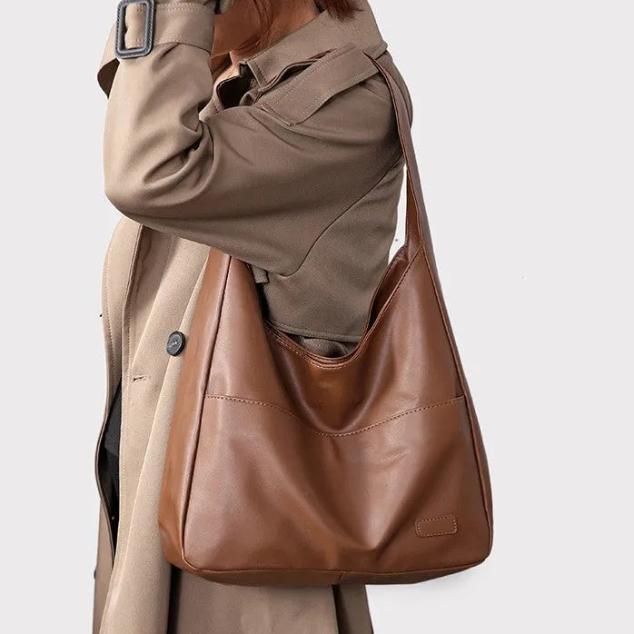 Women's soft PU shoulder bag in retro style with open pocket, shown in one of four colours