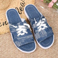 Blue women's Roman style flat canvas slippers with a rubber sole.