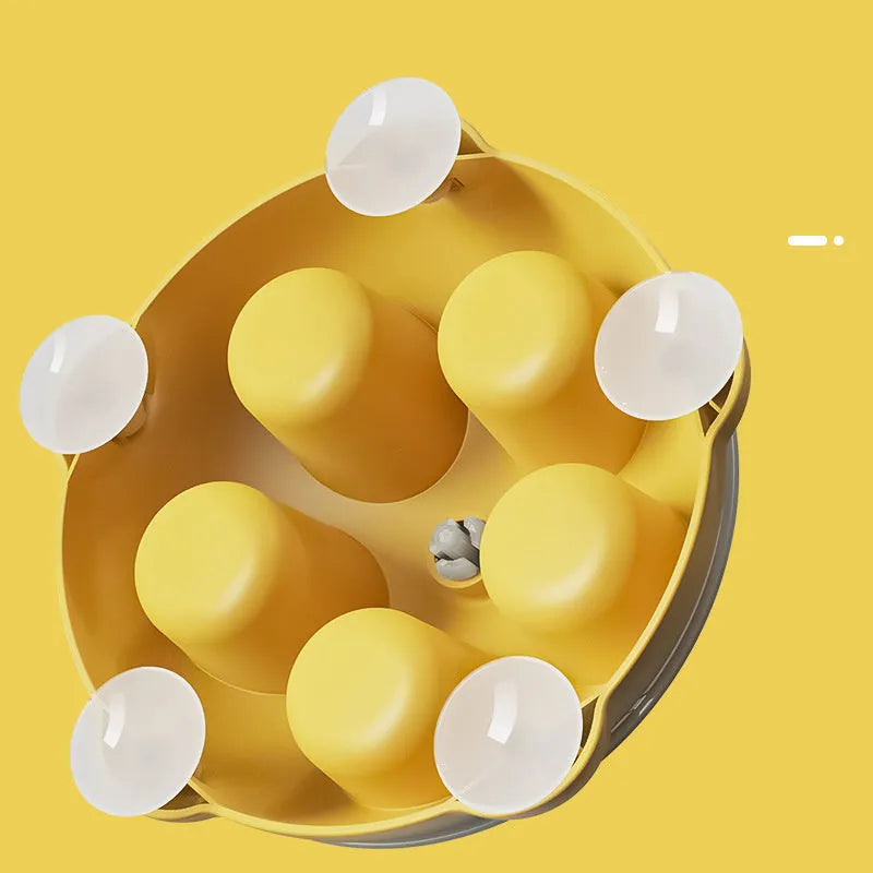Yellow interactive slow feeder pet plate with puzzle channels and central snack compartments