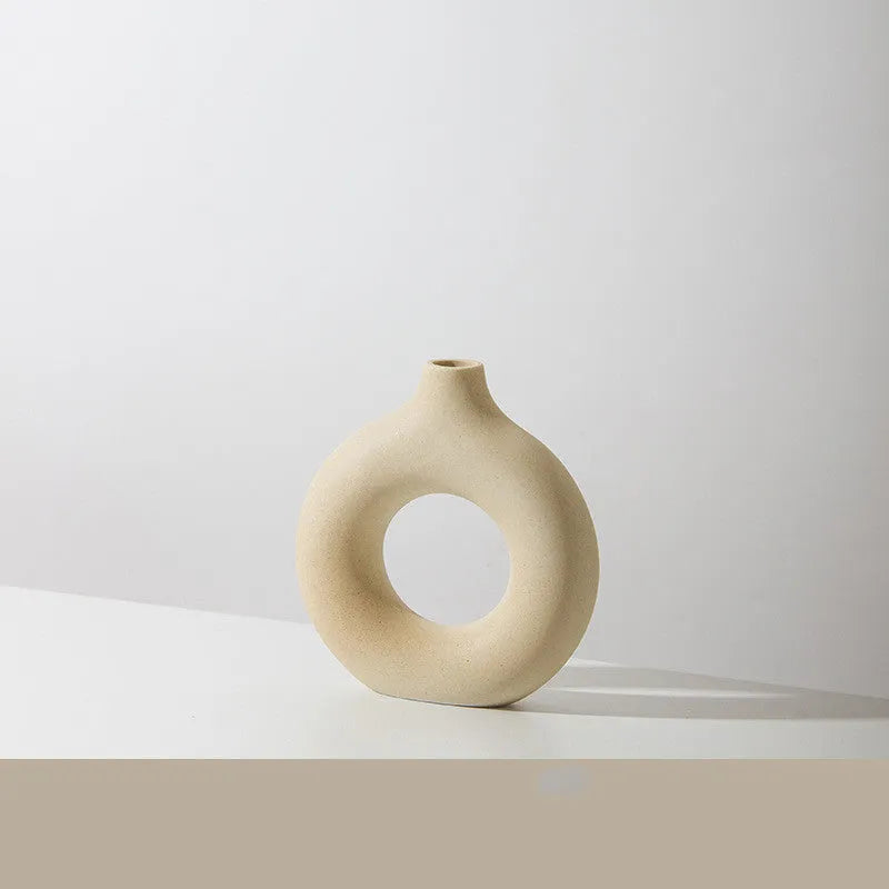 A simple modern frosted porcelain biscuit vase for flower arranging, shown in a neutral colour.