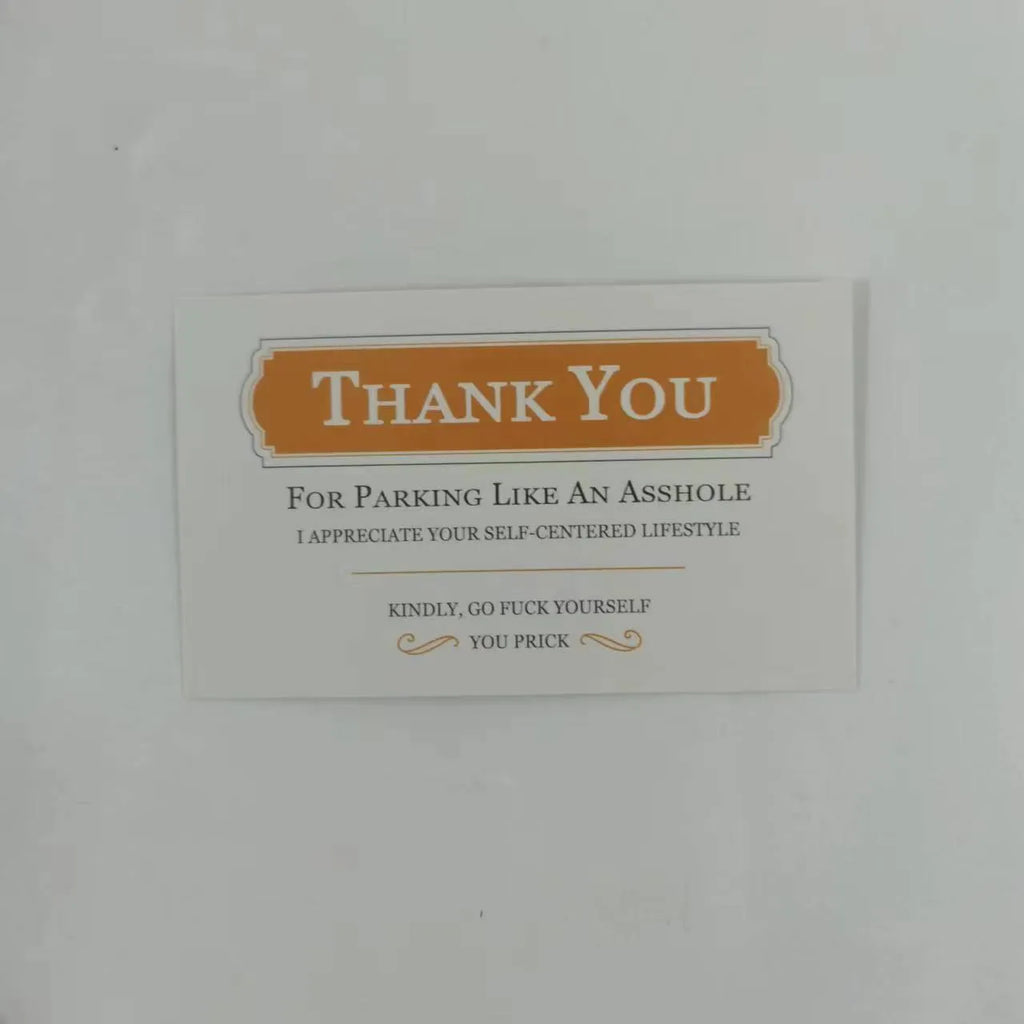 Box of paper illegal parking reminder cards showing a middle finger graphic.