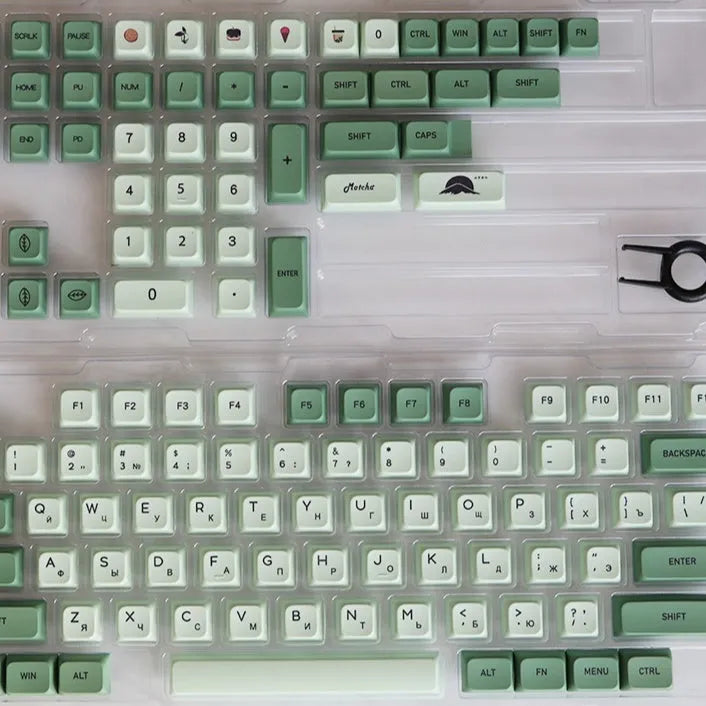 124-key matcha green PBT keycap set showing multiple international language layouts including Arabic and Korean.
