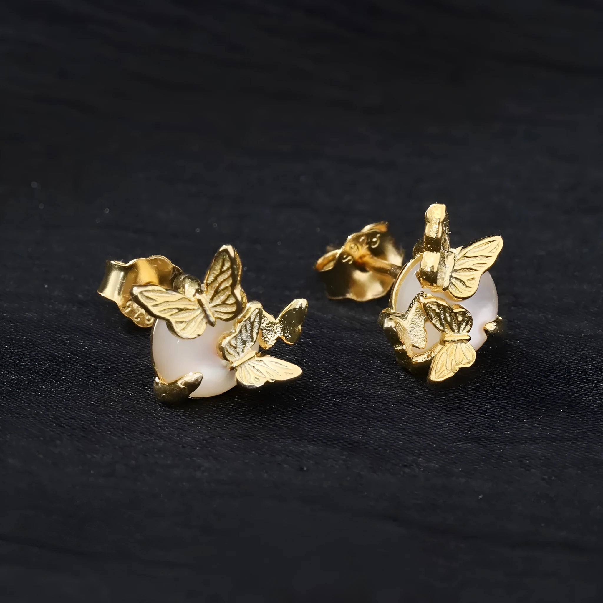 Pair of butterfly stud earrings in 925 silver with gold or white gold electroplated finish.