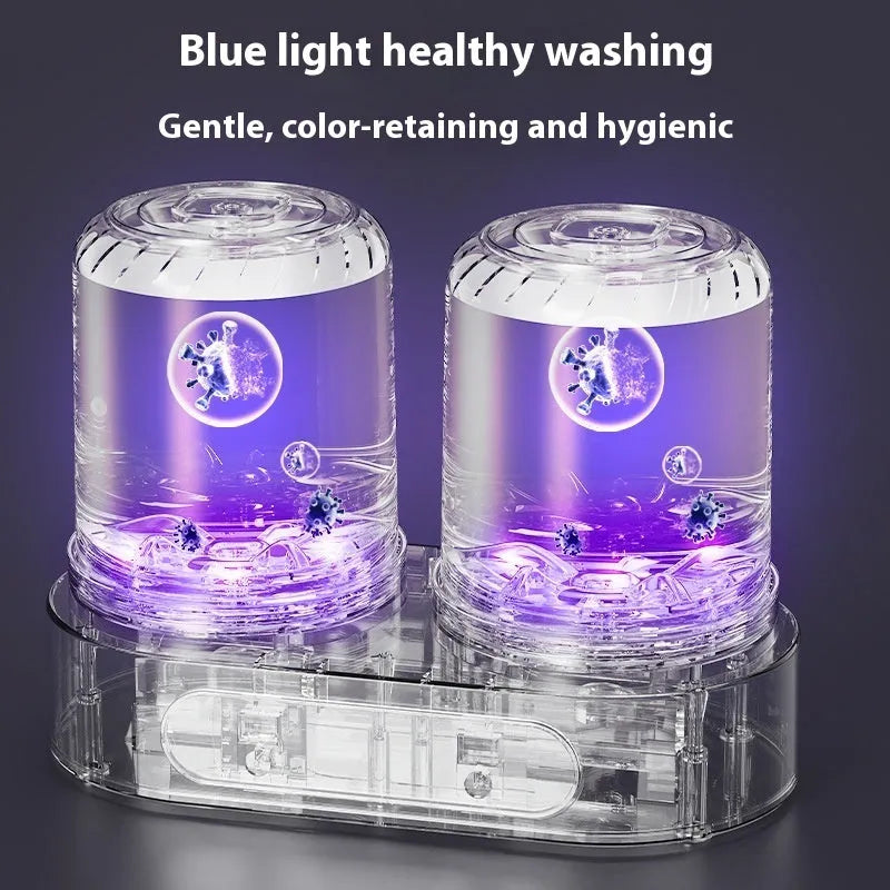 White double-bucket mini USB washing machine with two lids and a USB cable on a countertop.