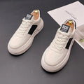 Unisex white, black, and green cloth sports casual shoes with rubber foam soles.