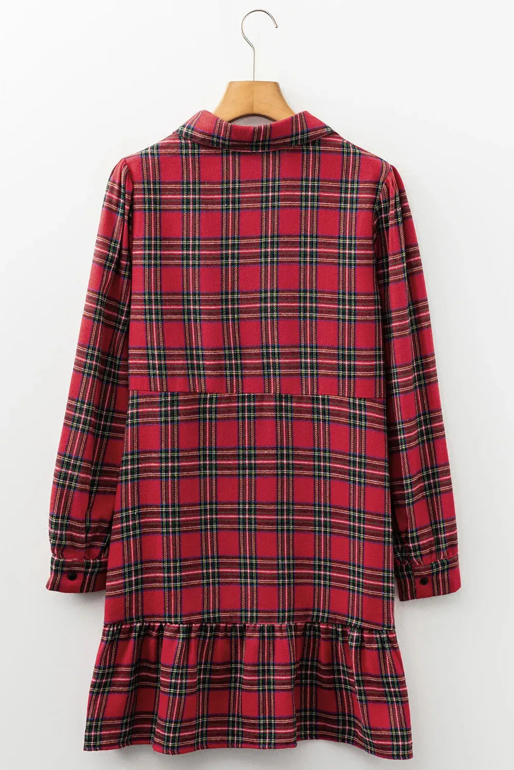 Red and black plaid mini dress with a shirt collar, long sleeves, half-button front, and a ruffled hem.