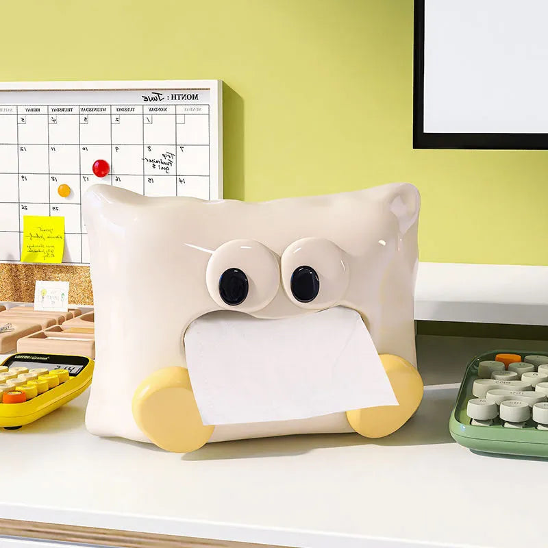 White ceramic tissue box holder with polished glazed finish on coffee table
