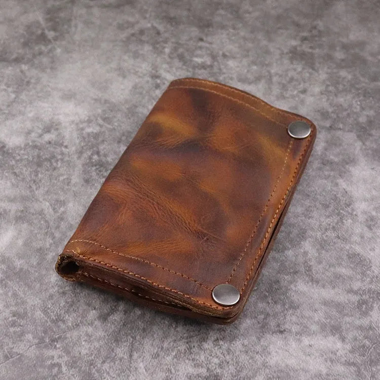 Men's retro-style long cowhide leather wallet open to show card slots, coin pocket, and bill compartment.
