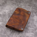 Men's retro-style long cowhide leather wallet open to show card slots, coin pocket, and bill compartment.