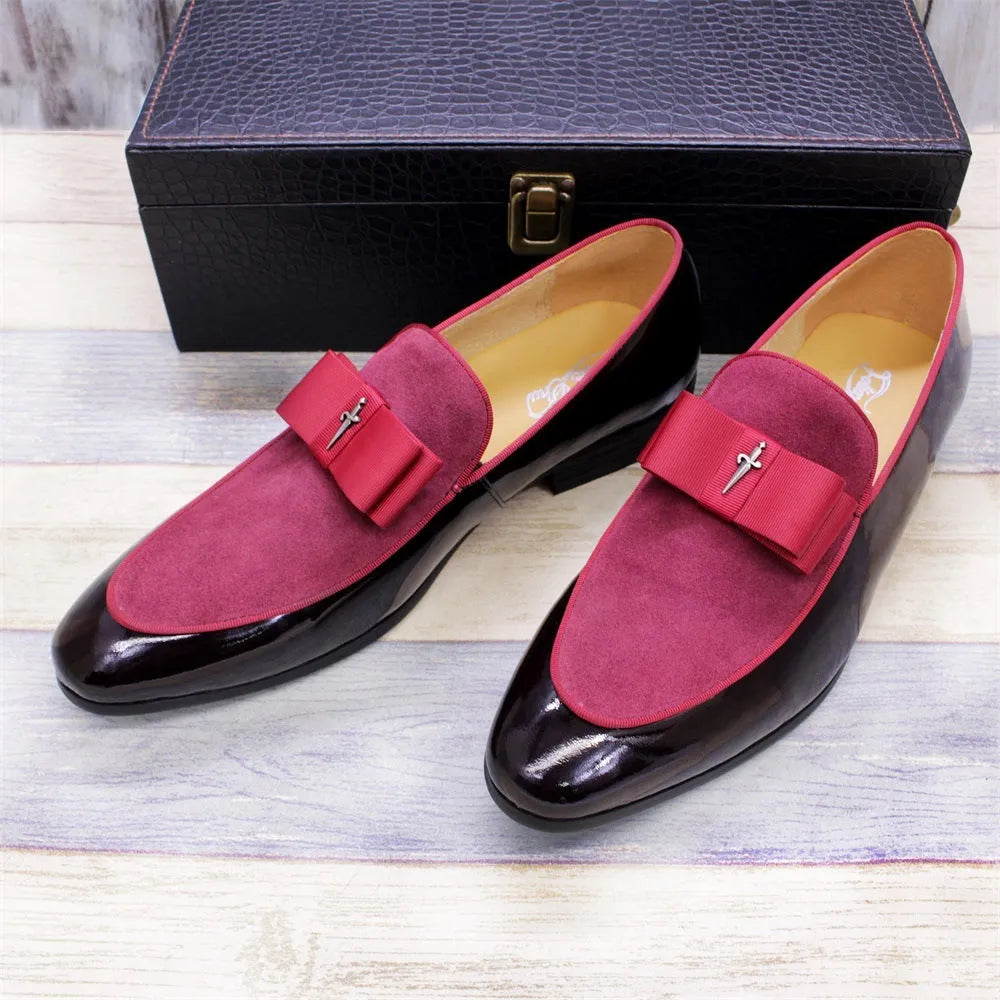 Men's glossy black patent leather low-top shoes with a tassel on a leather toe holder.