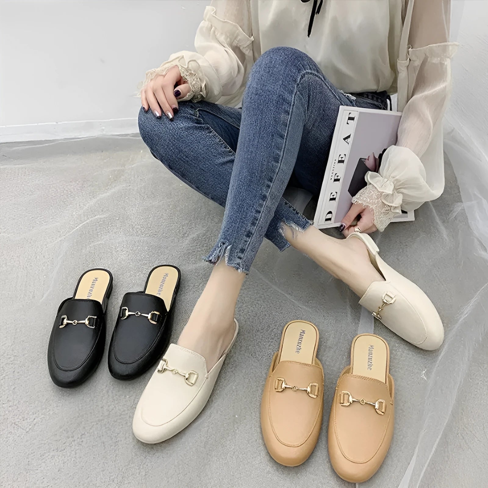 Women's PVC closed toe half slipper in white with a double buckle, shown on a foot.