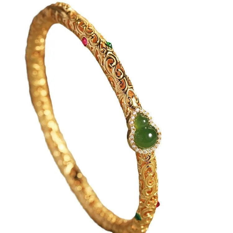 Gold-plated open back women's bracelet with traditional Chinese gourd charm on copper construction