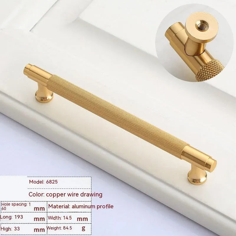 Brushed brass aluminium wardrobe handle with visible mounting holes for cabinet furniture.