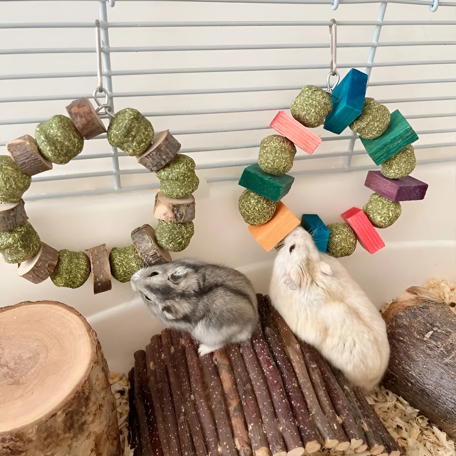 Hamster gnawing toy made of straw forming a ball ring, for small pets like guinea pigs.