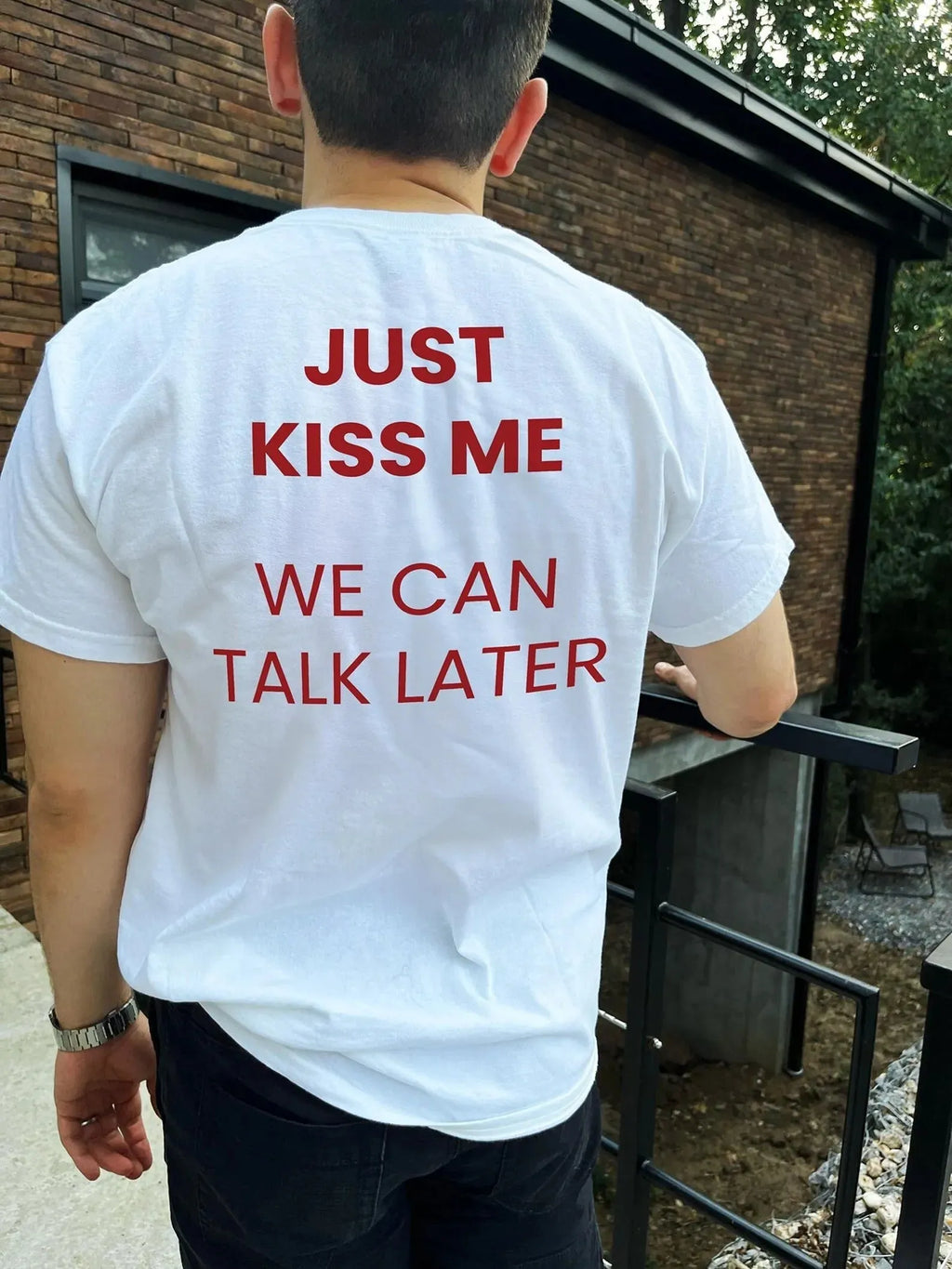 Men's printed short sleeve cotton t-shirt on a hanger showing street fashion design.