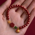 New Chinese style bracelet with emperor sandstone beads and a red Fu character charm.