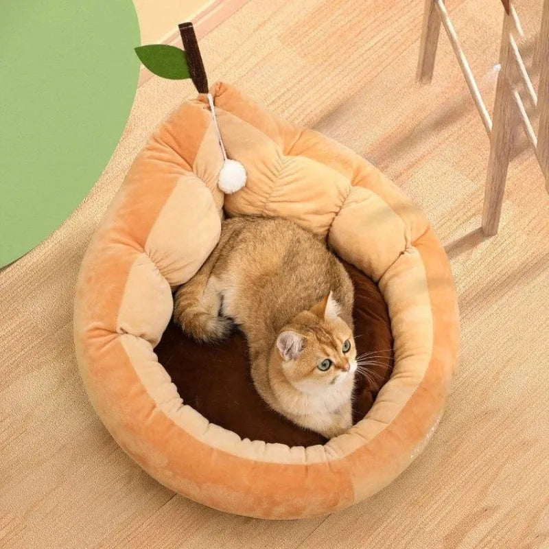 Green cotton pet bed with a plush raised rim for a cat or small dog.