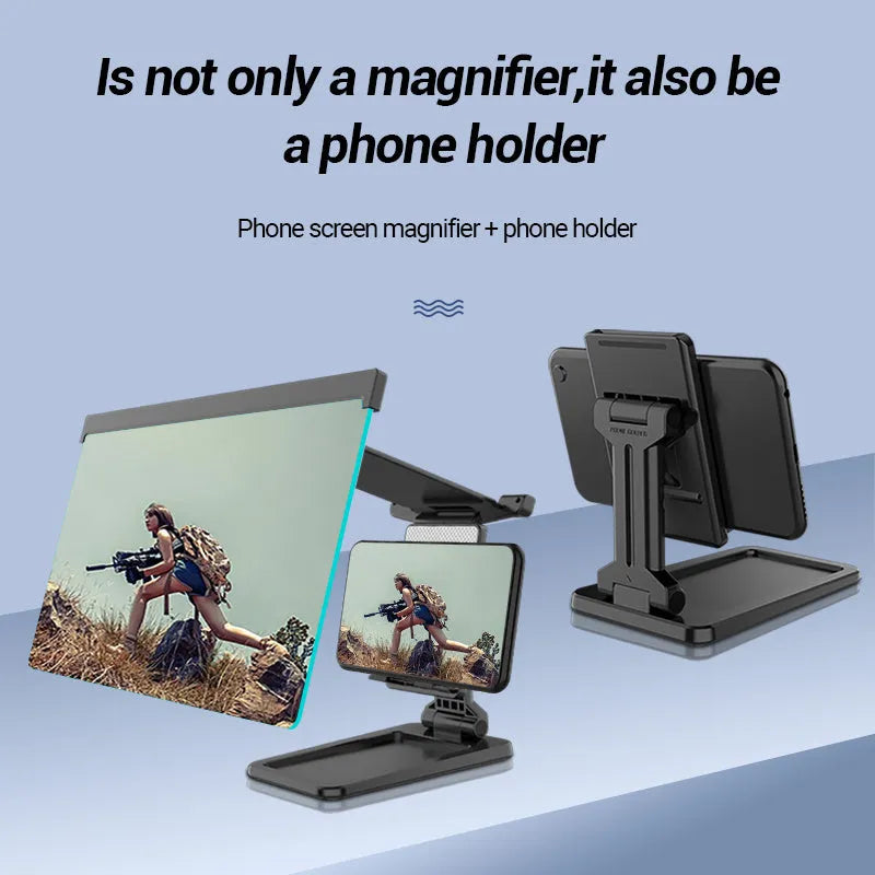 Black foldable mobile phone screen amplifier and detachable holder set up on a desk.