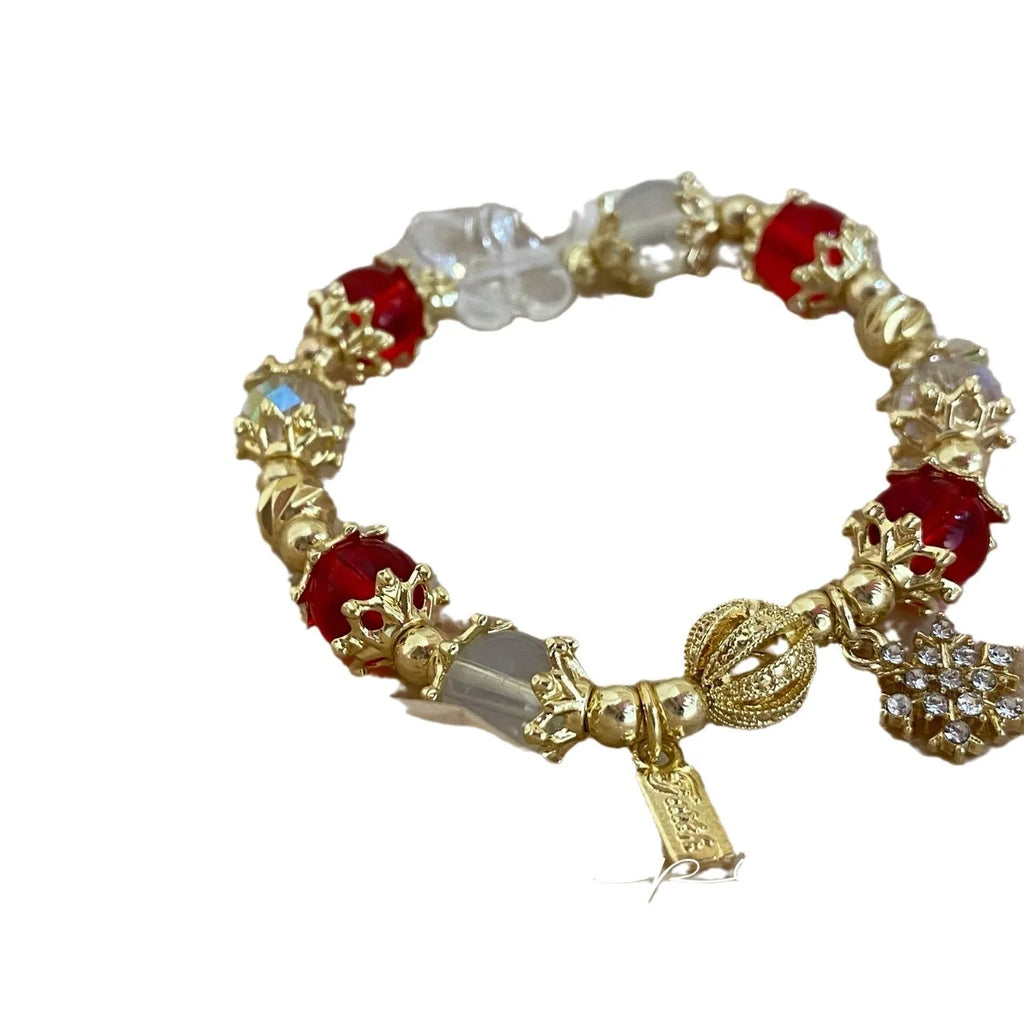 Women's bracelet with snowflake pendant and bow charm in galaxy colour