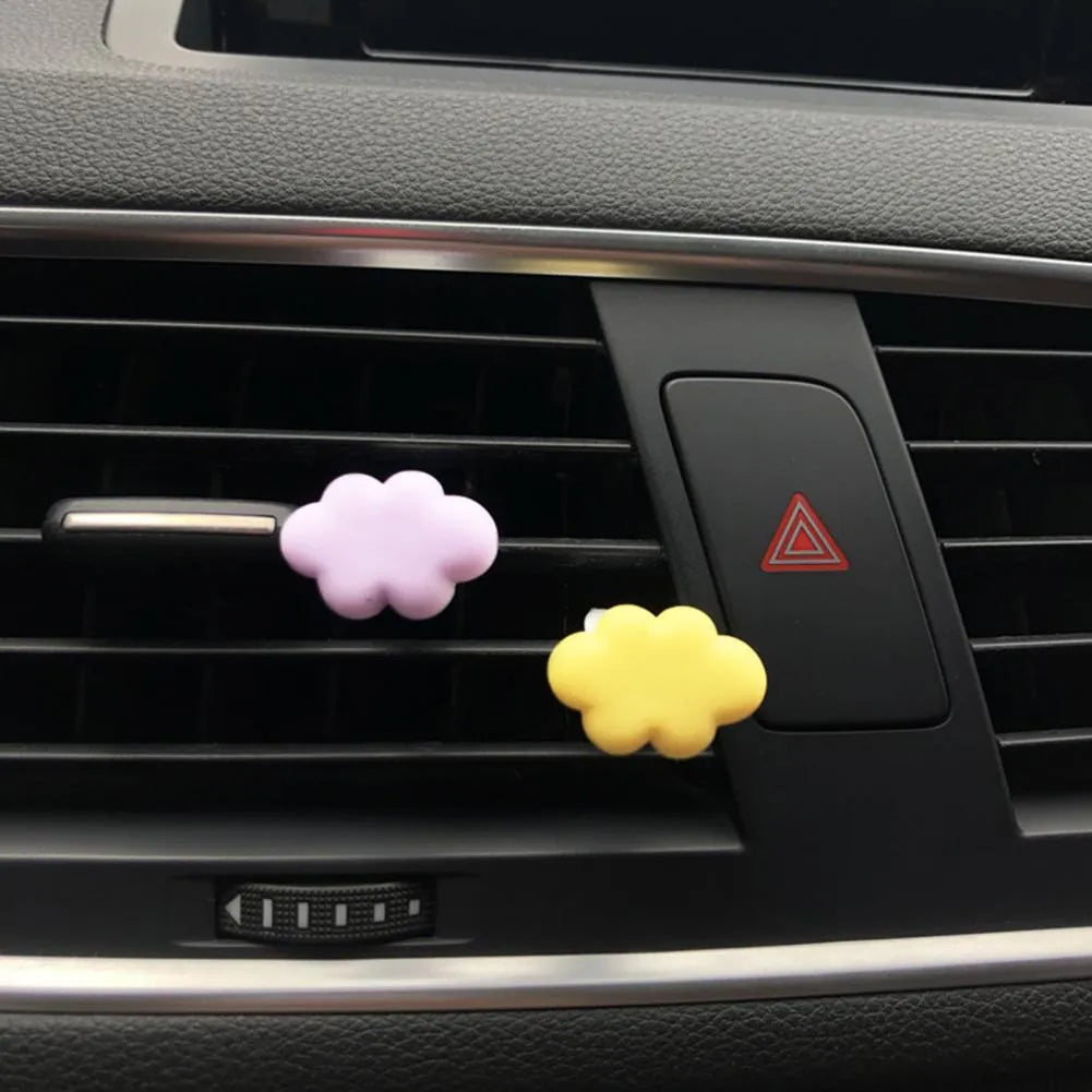Resin Baiyun cartoon car fragrance clip for air vents in assorted colours.