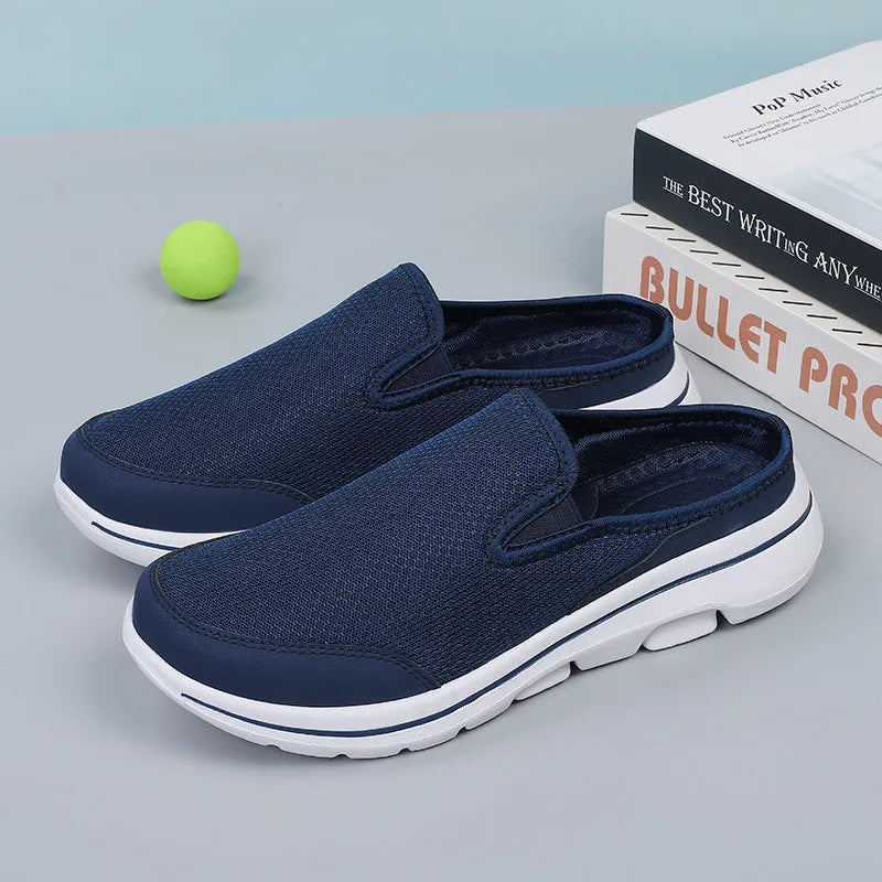 Breathable mesh toe holder slippers in solid colours on a flat heel sole.