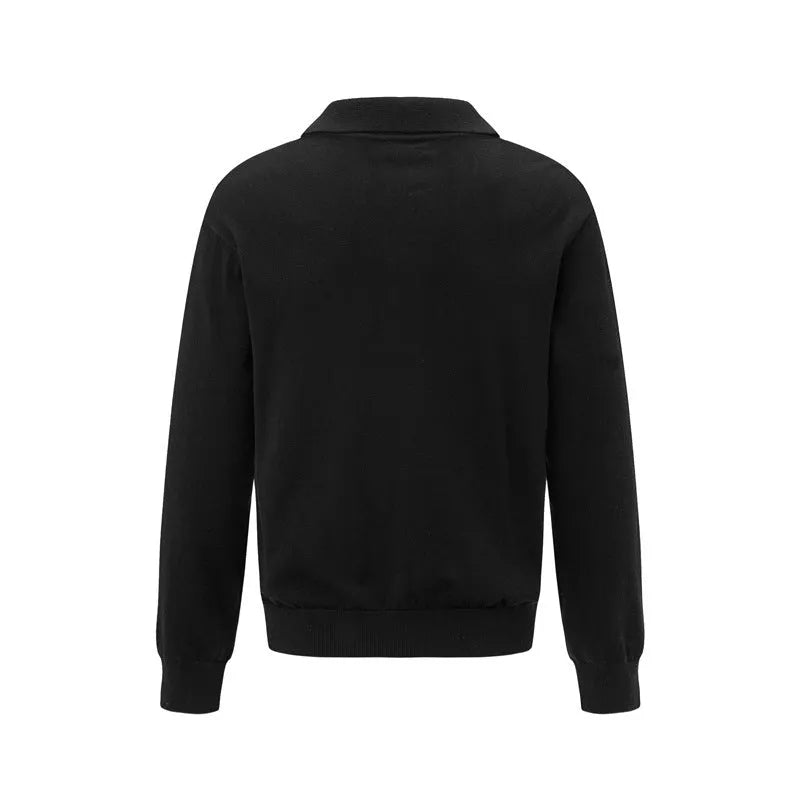 Loose fit black pullover sweater on a hanger, casual wear
