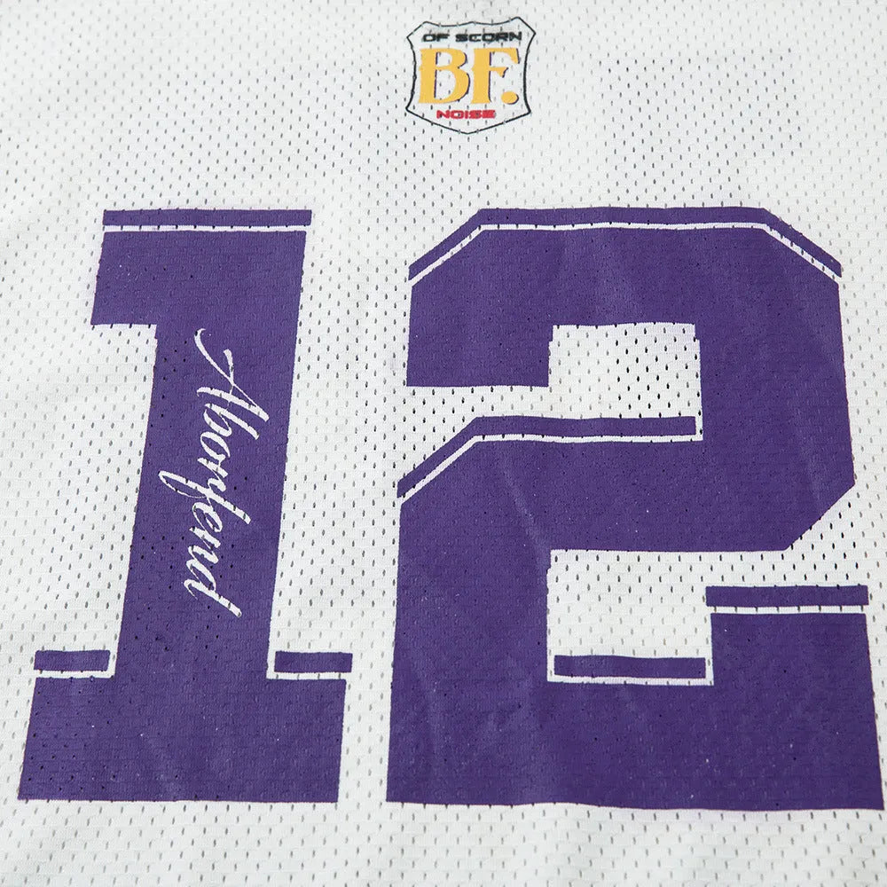 Man wearing a black loose-fit V-neck long-sleeved t-shirt with a digital contrast colour print.