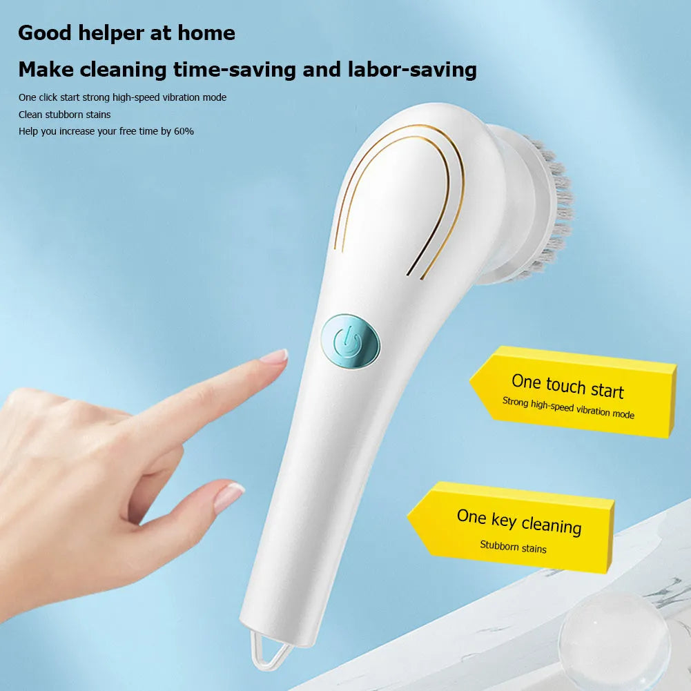 White cordless electric handheld scrubber with five attached brush heads on a table next to a USB charging cable.