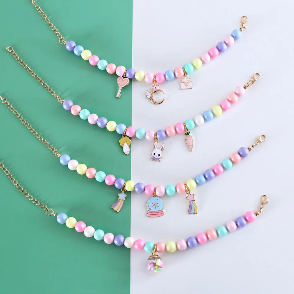 Colourful resin pet collar and bracelet set with moon and rabbit charms in macaron colours.