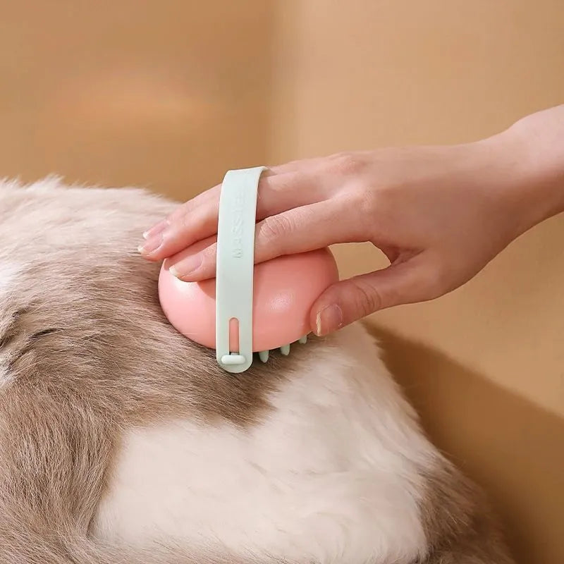 Blue silicone pet bathing brush with soft bristles for washing and massaging cats or dogs.
