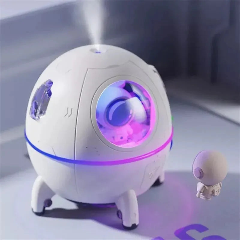 Astronaut-themed desktop USB humidifier with colourful LED lights and water tank.