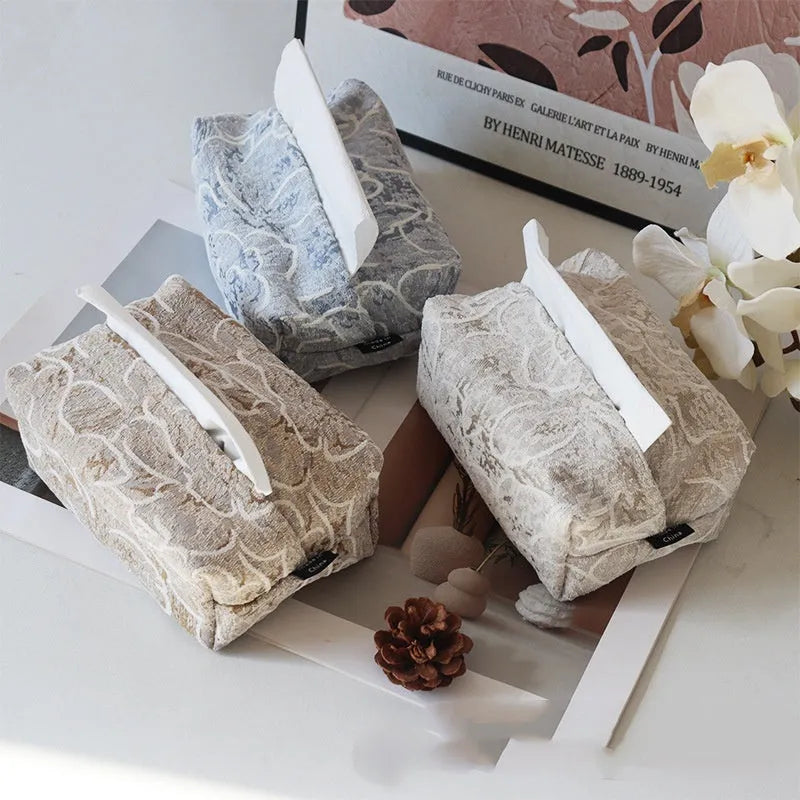 Pastoral style cotton fabric tissue box cover in beige, blue, and brown colours on a tea table.