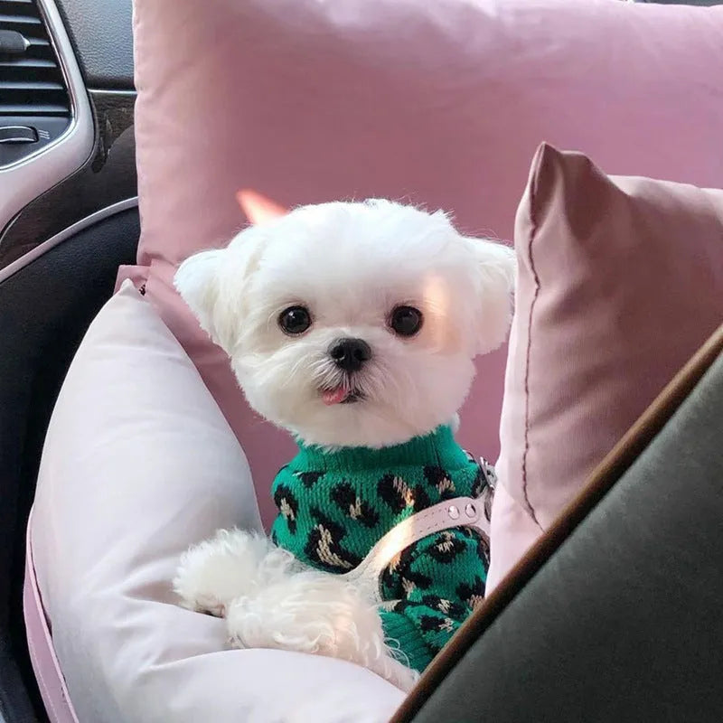 Green leopard print sleeveless knitted sweater for small dog or cat laying down