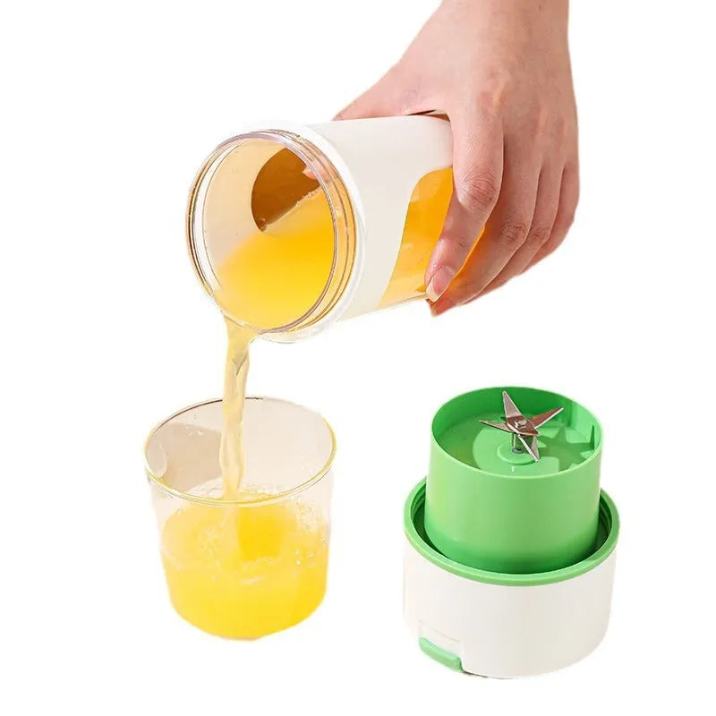 Blue portable USB rechargeable electric juicer and blender with 400ml cup on a kitchen counter.