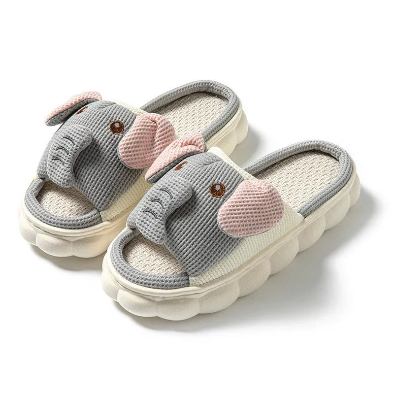 Elephant grey linen open-toe slippers for couples on a plain background, showing hand-sewn PVC sole.
