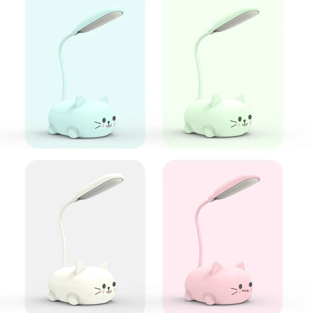 LED cartoon cat desk lamp in pink with USB rechargeable battery and ABS body on a desk