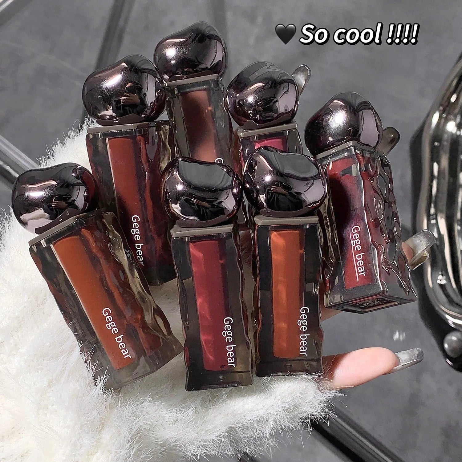 Mirror lip gloss with glacier lava formula in seven colour options showing reflective, luminous finish