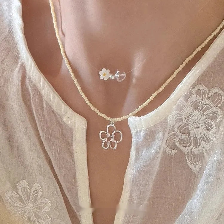 Korean style women's copper necklace with beaded hollow flower pendant and electroplated finish