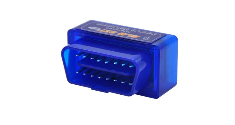 Small black OBD2 Bluetooth scanner car diagnostic code reader next to a vehicle's diagnostic port.